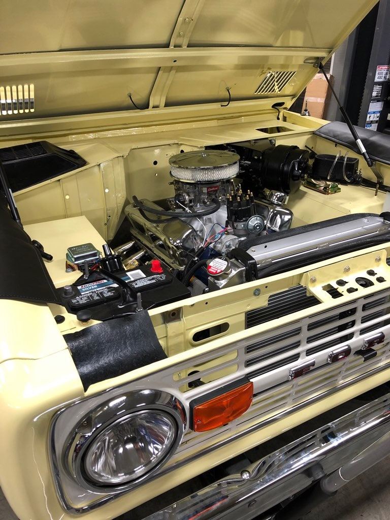 Front view of the engine bay with restored grille and chrome bumper