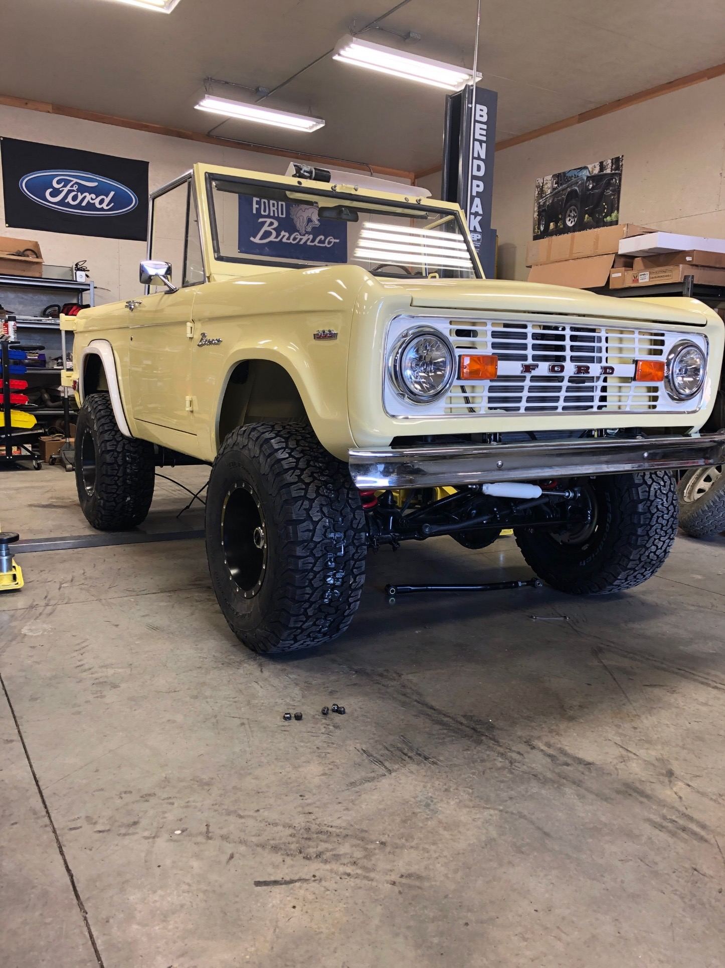 Baby Palomino complete, front three-quarter view in butter yellow with black wheels