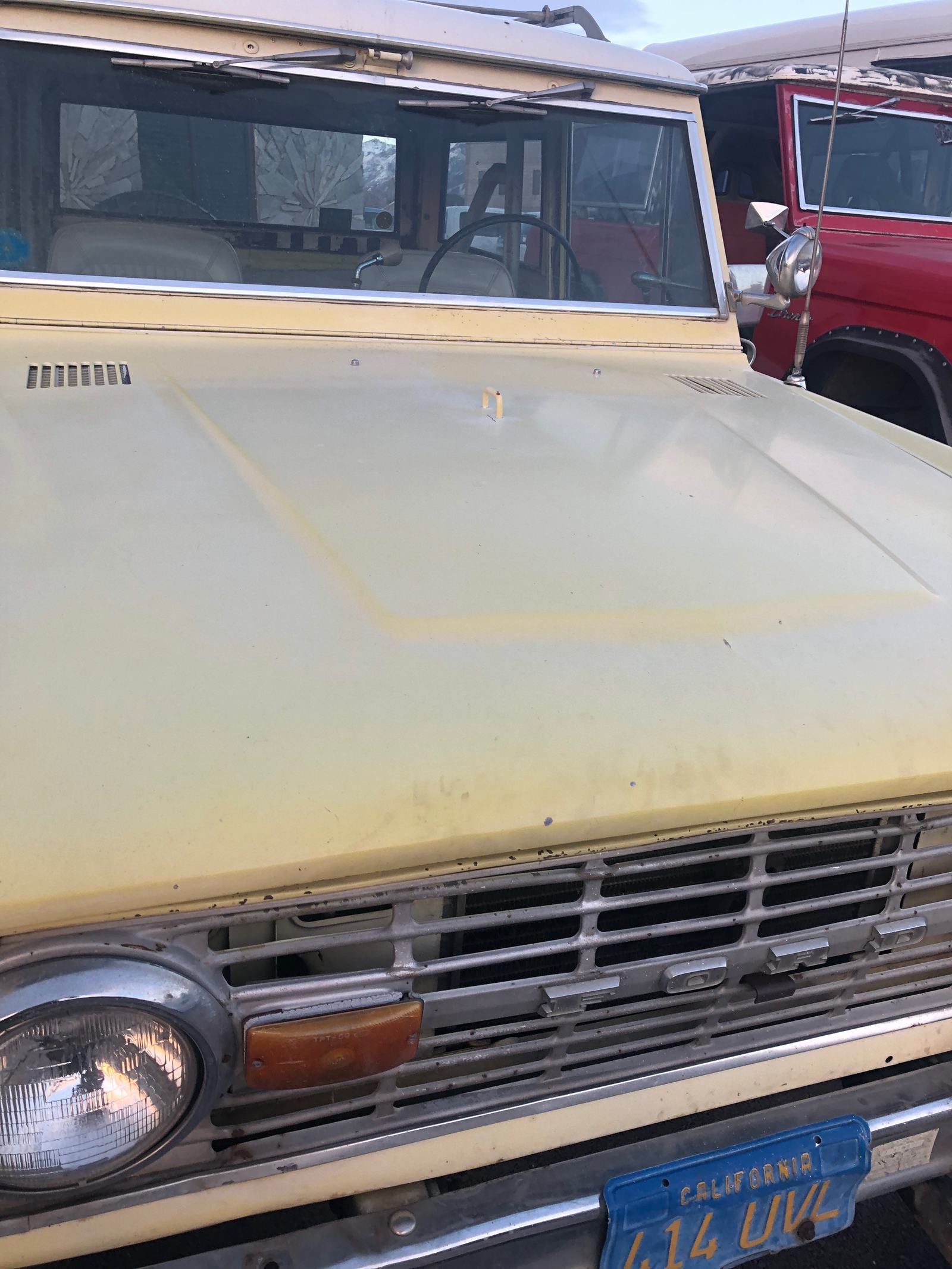 Close view of the original weathered hood and grille before restoration
