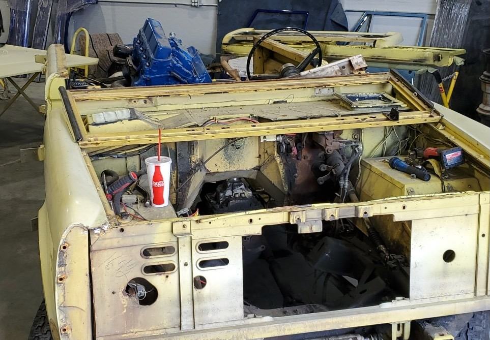 Body shell stripped with engine bay empty during disassembly