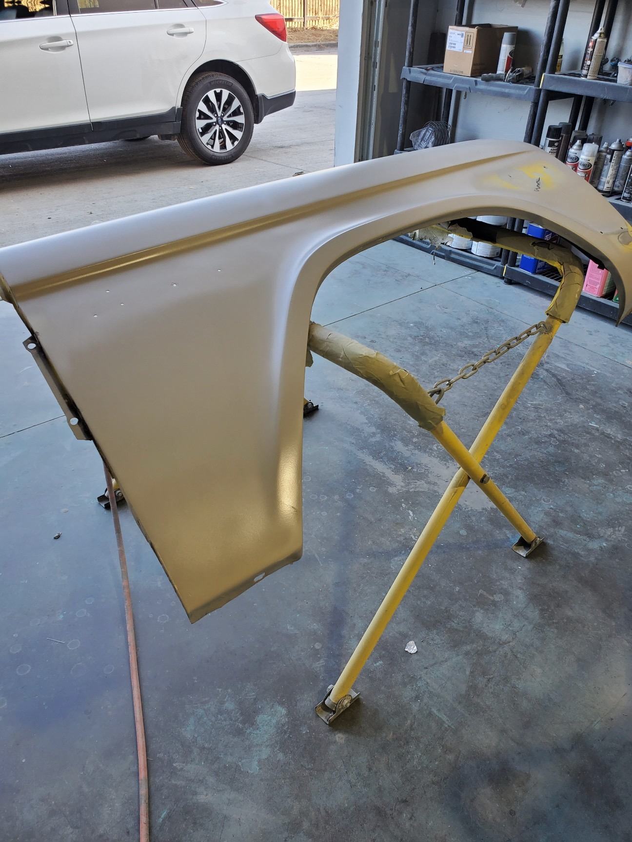 Hard top section on a stand during refinishing