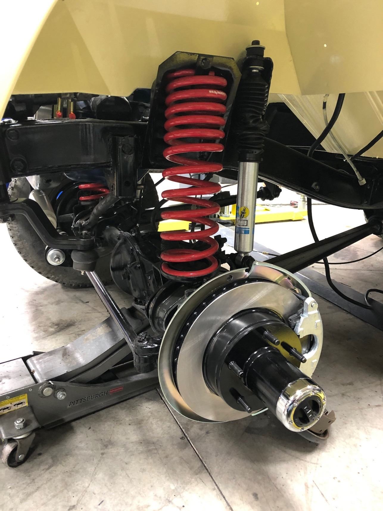 New coil spring suspension with Bilstein shock and front disc brake