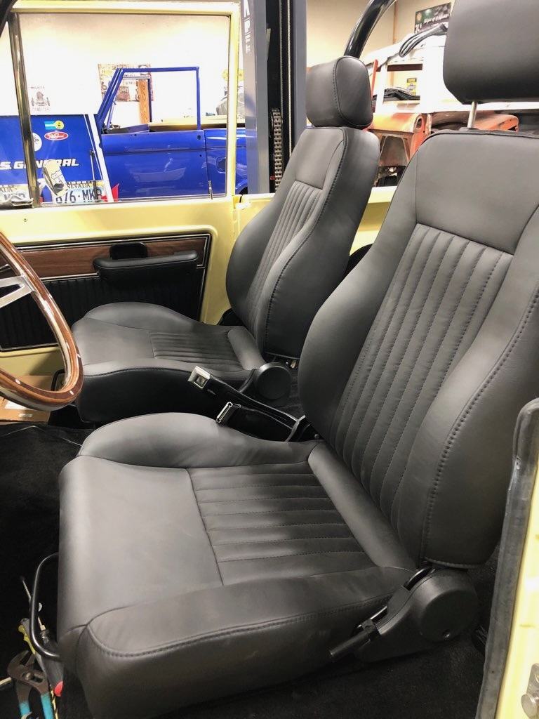 Black front bucket seats installed in the finished interior