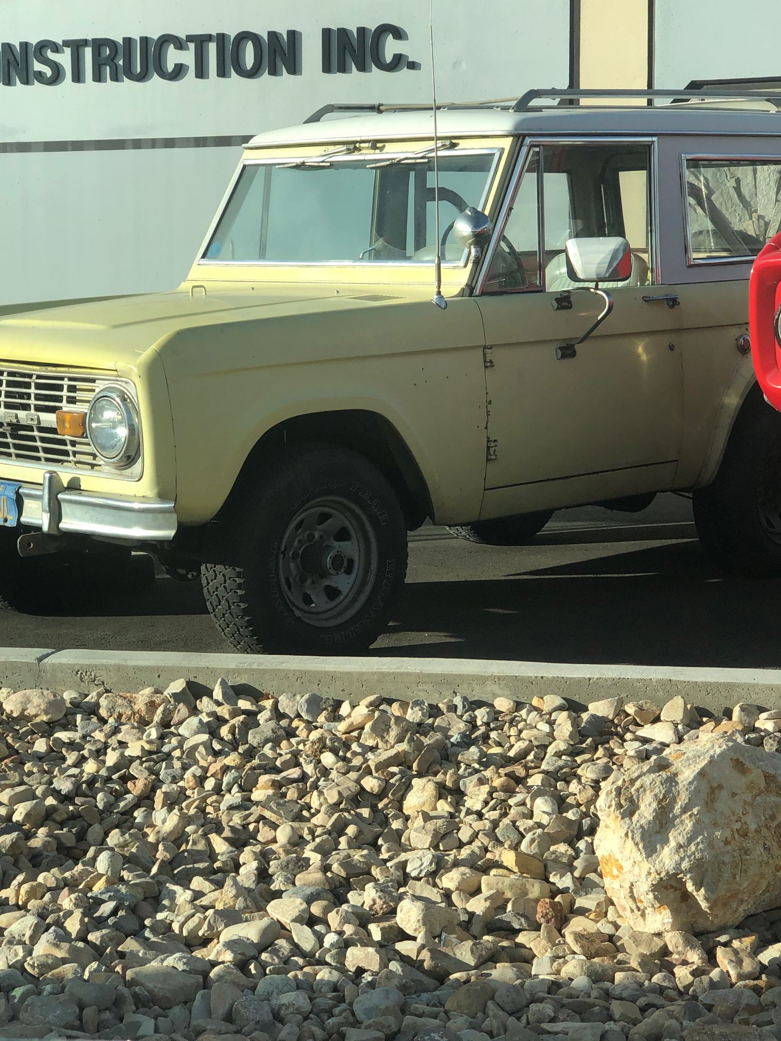 The Bronco as found before restoration, wearing its original faded yellow paint